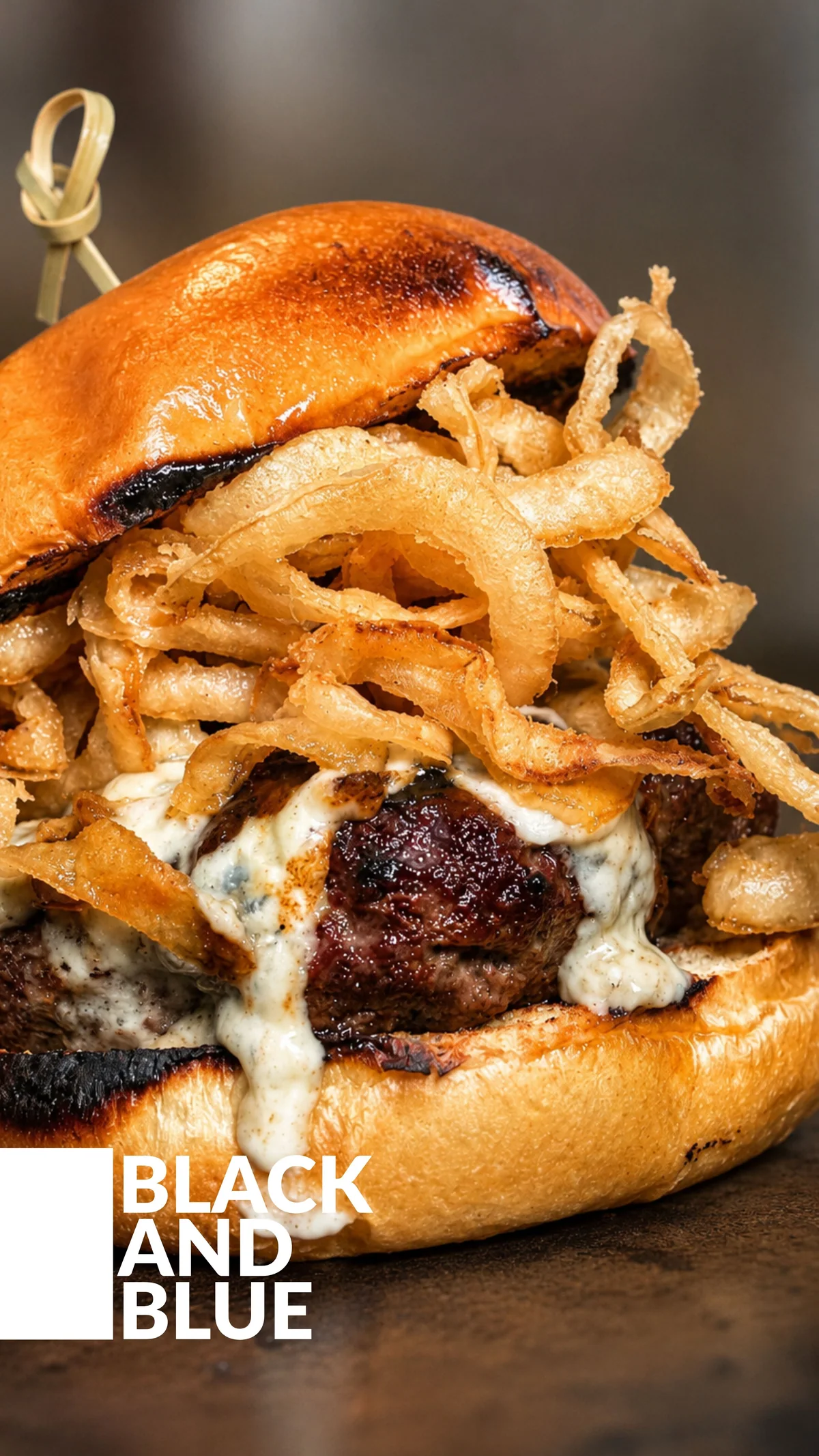 Bergen Munchies burger topped with crispy onions and creamy sauce